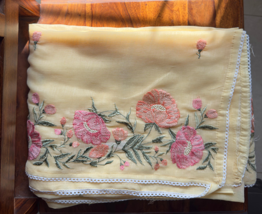 Pastel Linen Saree with Exquisite Floral Embroidery & Lace Border